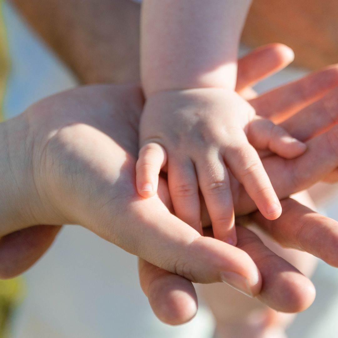 Close-up Photo of Baby's Hand on Parent's Hands-widen.com.au