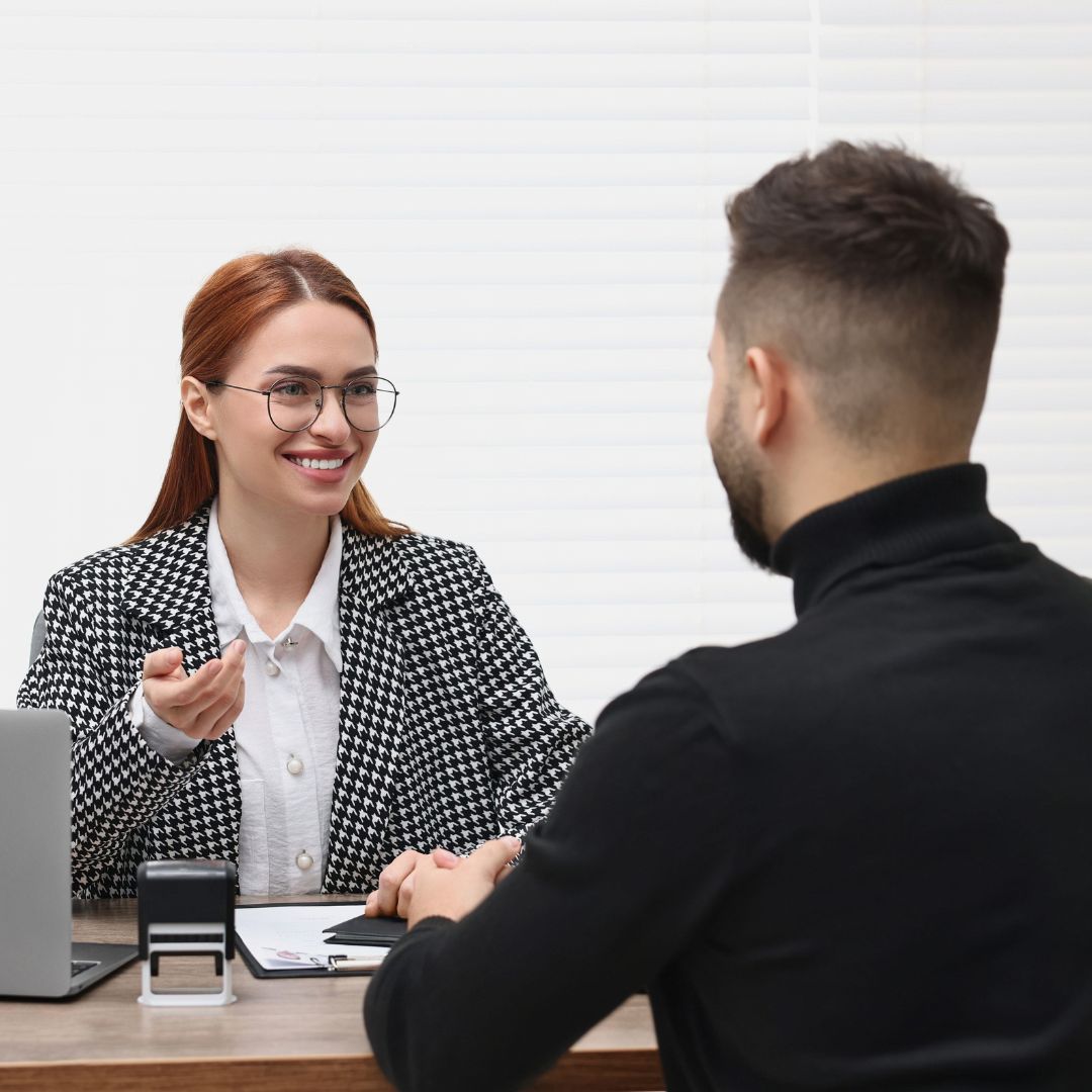 Smiling Embassy Worker Consulting Man about Immigration-widen.com.au