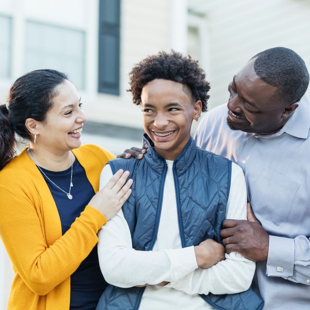 Teenage boy with parents outside home-widen.com.au